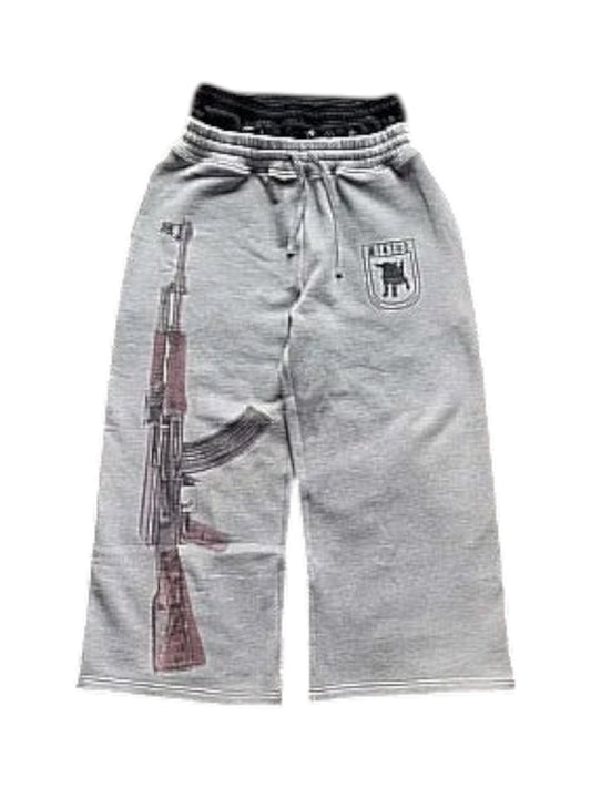 SwagArchieve grey cotton blend sweatpants with wide leg, AK-47 graphic print on left leg, drawstring waist, and embroidered logo.