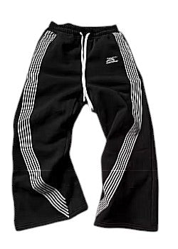SwagArchieve black athletic track pants with white triple stripe detailing down the sides and a drawstring waist.
